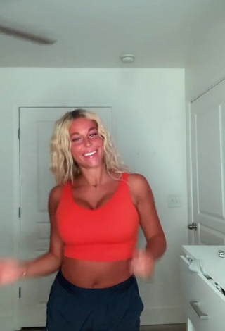 3. Erotic Tiffany Jeffcoat Shows Cleavage in Orange Sport Bra