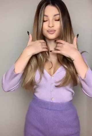 1. Erotic Valerie Lungu Shows Cleavage in Violet Top
