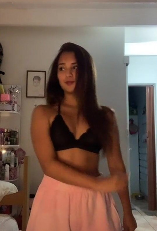 3. Erotic Yess Shows Cleavage in Black Bra