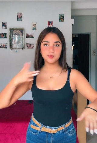 Irresistible Yess Shows Cleavage in Black Top