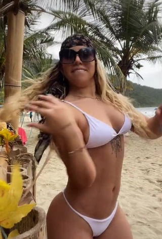 Captivating Chantall Pizzino Shows Cleavage in White Bikini at the Beach