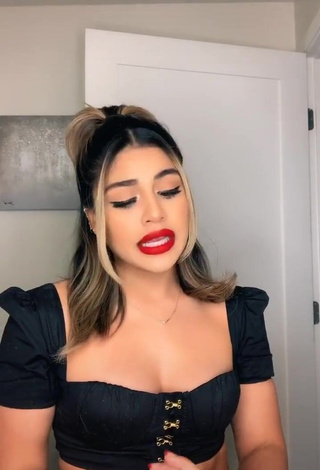 Attractive Gabriela Bandy Shows Cleavage in Black Crop Top