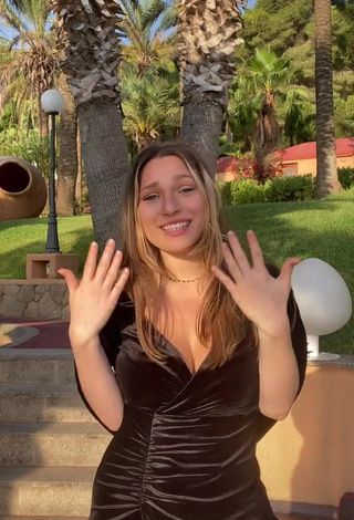 Erotic Lucy Lacht Shows Cleavage in Black Dress