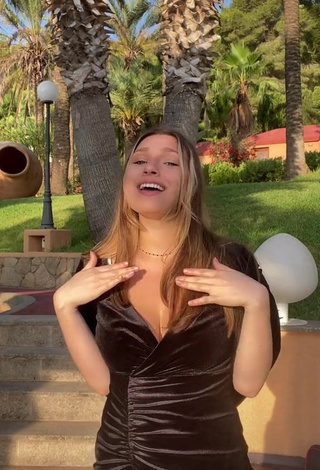 3. Erotic Lucy Lacht Shows Cleavage in Black Dress