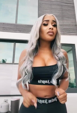 Irresistible DreamDoll Shows Cleavage in Black Crop Top
