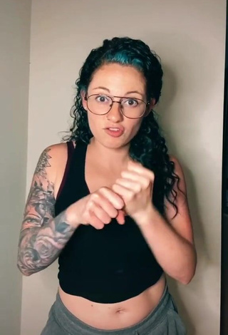 Erotic Tabatha Marie Shows Cleavage in Black Tank Top