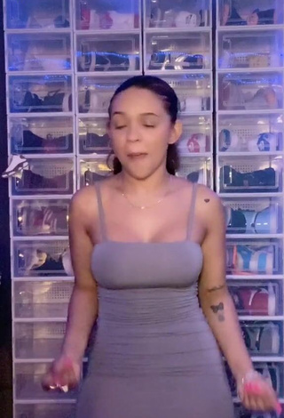 1. Sweetie River Bleu Shows Cleavage in Grey Dress