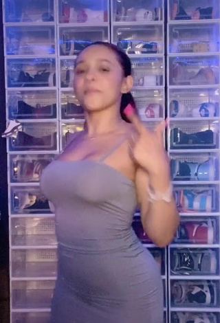 3. Sweetie River Bleu Shows Cleavage in Grey Dress