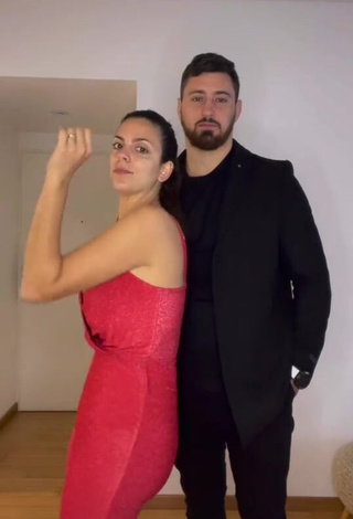 Erotic Belu Lucius Shows Cleavage in Red Bodysuit