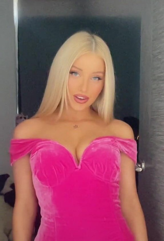 Erotic Charlotte Parkes Shows Cleavage in Pink Dress
