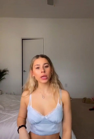 Erotic Emily Alexander Shows Cleavage in Blue Crop Top