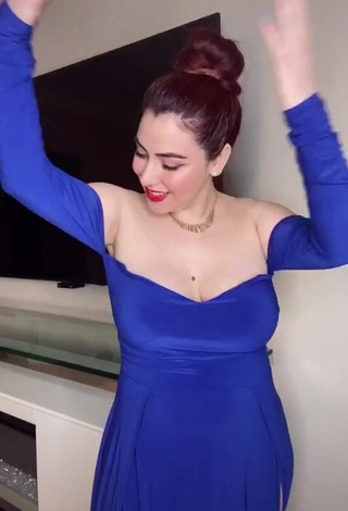 3. Irresistible Jane Rocci Shows Cleavage in Blue Dress