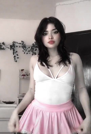 1. Erotic Pantograma Shows Cleavage in White Bodysuit