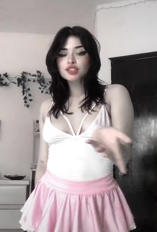 3. Erotic Pantograma Shows Cleavage in White Bodysuit