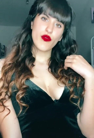 3. Seductive Alice Iori Shows Cleavage in Black Dress