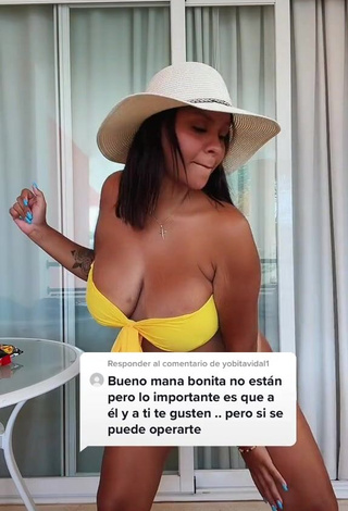 3. Hot Adelaida Tassoni Shows Cleavage in Yellow Bikini