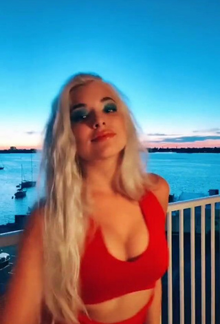 3. Wonderful Bella Martinez Shows Cleavage in Red Crop Top on the Balcony
