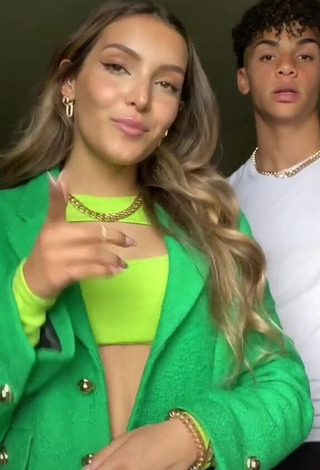 1. Erotic Corinne Pino Shows Cleavage in Green Crop Top