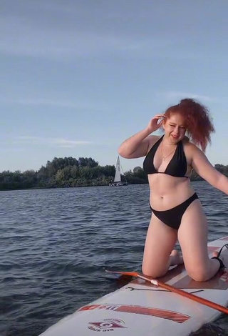 3. Erotic Elizaveta Strizh Shows Cleavage in Black Bikini in the Sea