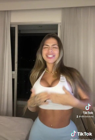 3. Hot Camila Xavier Shows Cleavage in White Sport Bra