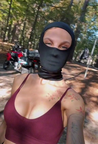 1. Erotic Sonya Shows Cleavage in Purple Crop Top