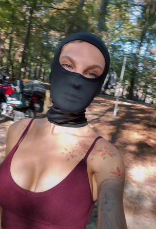 Erotic Sonya Shows Cleavage in Purple Crop Top
