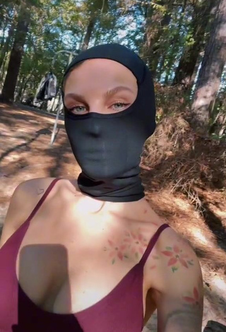 3. Erotic Sonya Shows Cleavage in Purple Crop Top