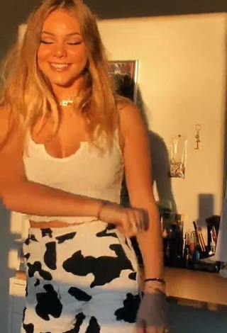 Seductive Romane Bertrand Shows Cleavage in White Crop Top