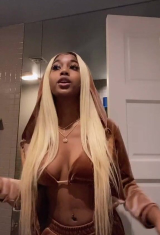 1. Erotic Tee Tee Shows Cleavage in Brown Bra