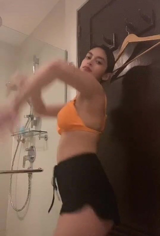 1. Erotic Yvonne Aresu in Orange Bikini Top