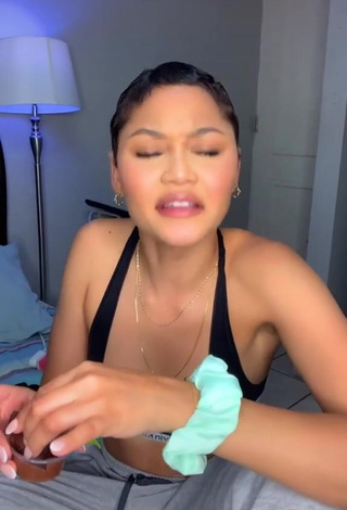 Erotic Adriana Shows Cleavage in Black Sport Bra