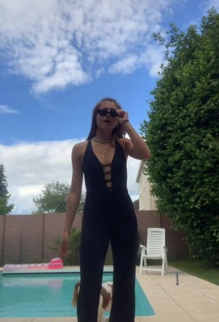 Erotic EstelleTvo Shows Cleavage in Black Overall at the Swimming Pool