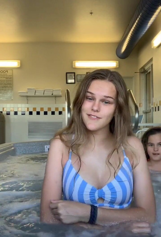 3. Erotic Dakota Young in Striped Bikini Top at the Swimming Pool