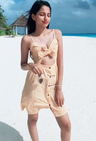 Captivating Khushi Hegde in Checkered Overall at the Beach