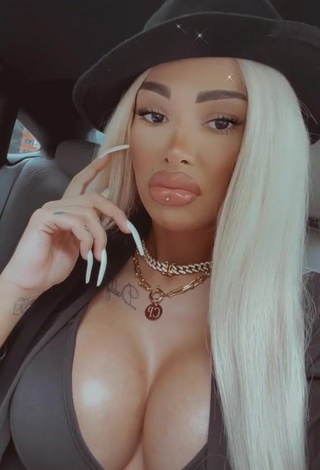 1. Erotic Cristina Pucean Shows Cleavage in Black Crop Top in a Car