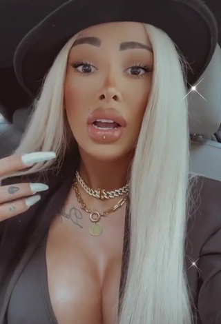 3. Erotic Cristina Pucean Shows Cleavage in Black Crop Top in a Car