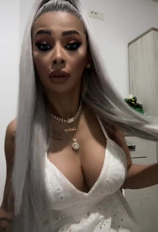 1. Cute Cristina Pucean Shows Cleavage in White Dress