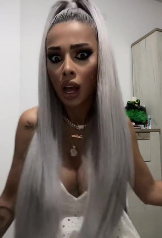 Cute Cristina Pucean Shows Cleavage in White Dress