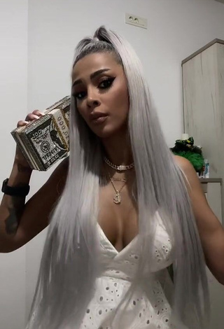 3. Cute Cristina Pucean Shows Cleavage in White Dress