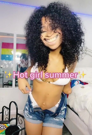 2. Irresistible Destinee Faire Shows Cleavage in White Bikini Top