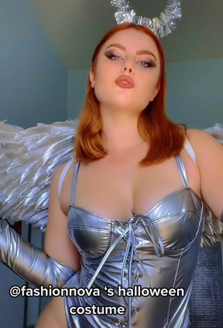 Erotic Giorgia Cavalluzzo Shows Cleavage in Silver Bodysuit