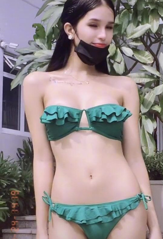 2. Irresistible Jing Alvarez Shows Cleavage in Green Bikini