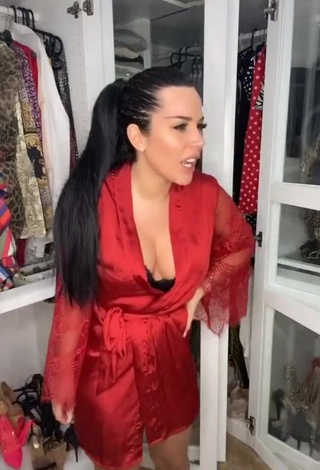 3. Erotic Laura Lempika Shows Cleavage in Red Bathrobe