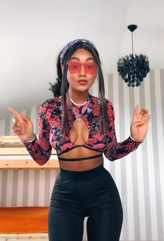 Seductive Elizabeth Anorue Shows Cleavage in Crop Top