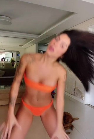 Seductive Luana Targinno Shows Cleavage in Orange Bikini