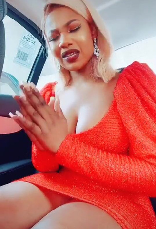 1. Cute Tacha Shows Cleavage in Red Dress in a Car