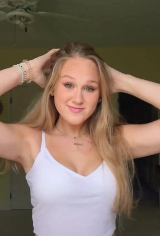 1. Irresistible Caiti Mackenzie Shows Cleavage in White Crop Top