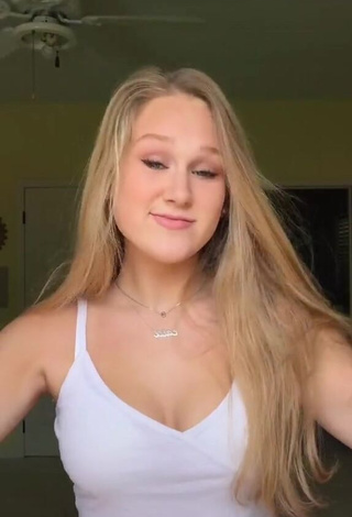 3. Irresistible Caiti Mackenzie Shows Cleavage in White Crop Top