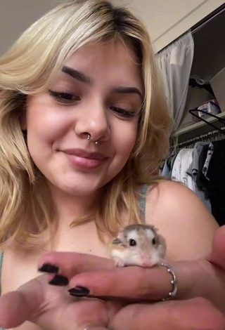 Erotic Eggthehamsterr Shows Cleavage in Grey Top