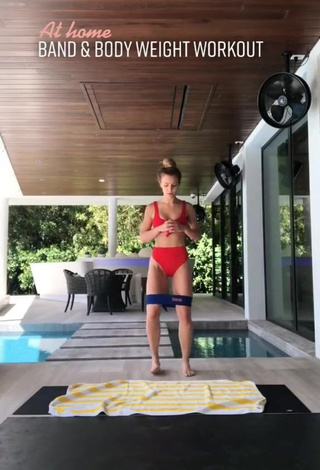 1. Erotic Elle Leonard in Red Bikini while doing Fitness Exercises